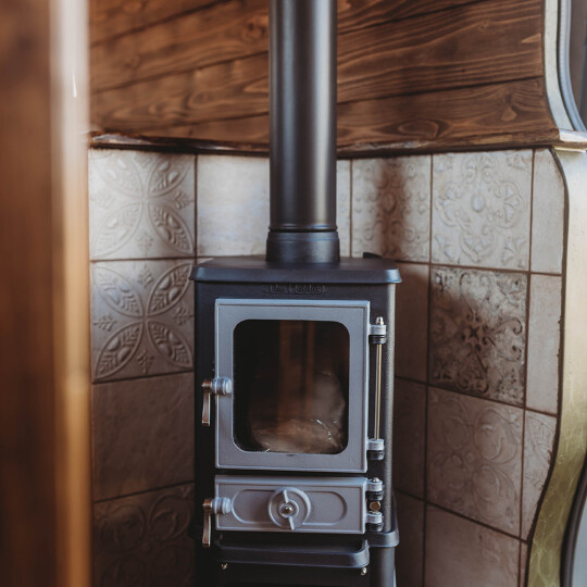 Hobbit small wood burning stove installed In A Supertramped Co Van Conversion